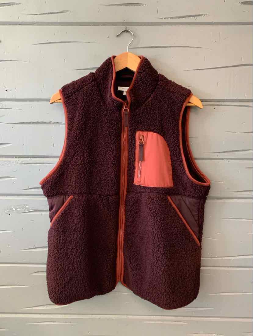 Burgundy fleece vest with a coral chest pocket, zip front, and contrasting trim.