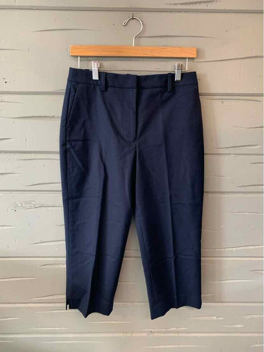 Navy blue tailored women's pants with belt loops and side pockets, size 4.