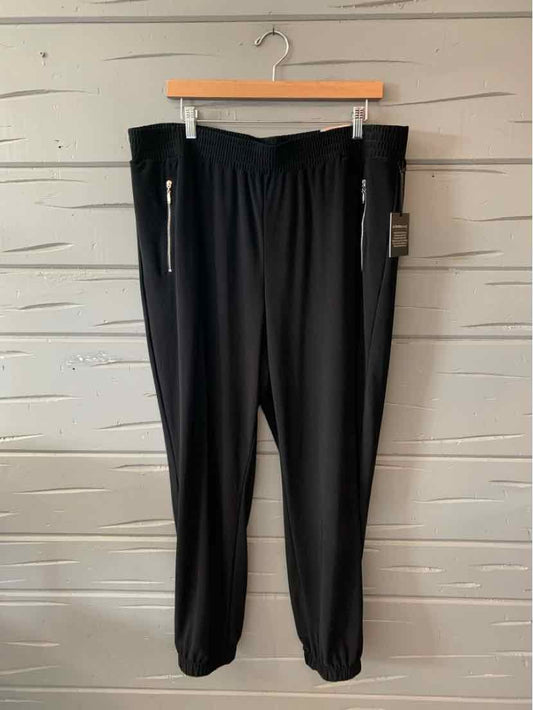 Black casual jogger pants with elastic waistband and zippered side pockets, size 3.