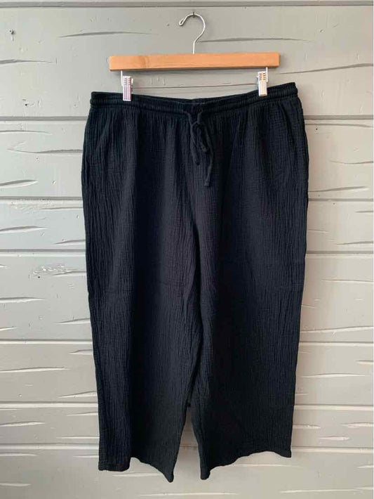 Black wide-leg pants with drawstring waist and side pockets, size XL.