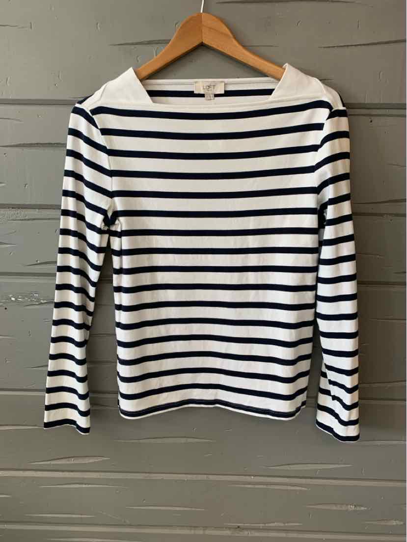 White long-sleeve shirt with navy horizontal stripes and a boat neckline on a wooden hanger.