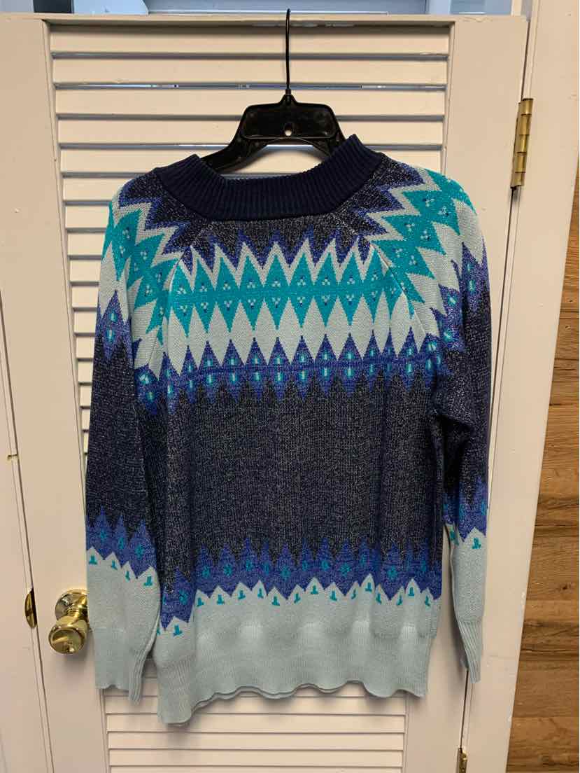 Women's medium denim blue sweater with geometric zigzag pattern in teal, white, and navy.