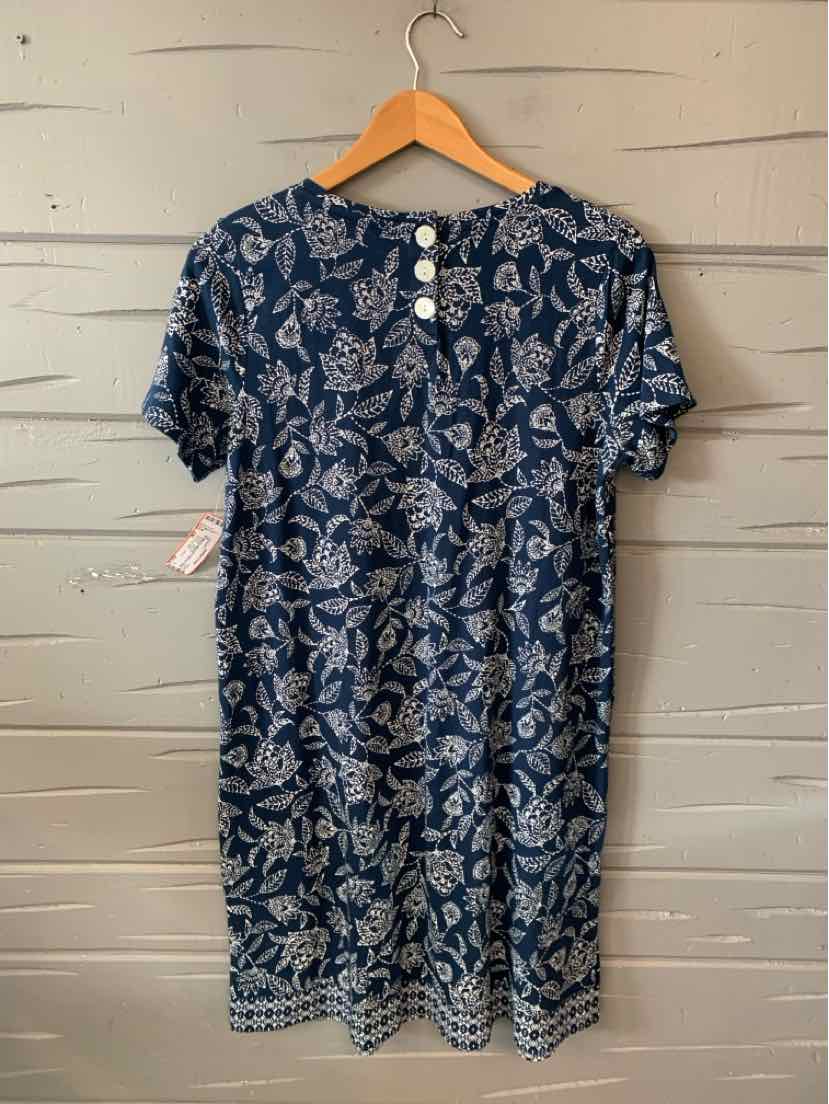 Navy blue short-sleeve dress with white floral print and three buttons on the back neckline.