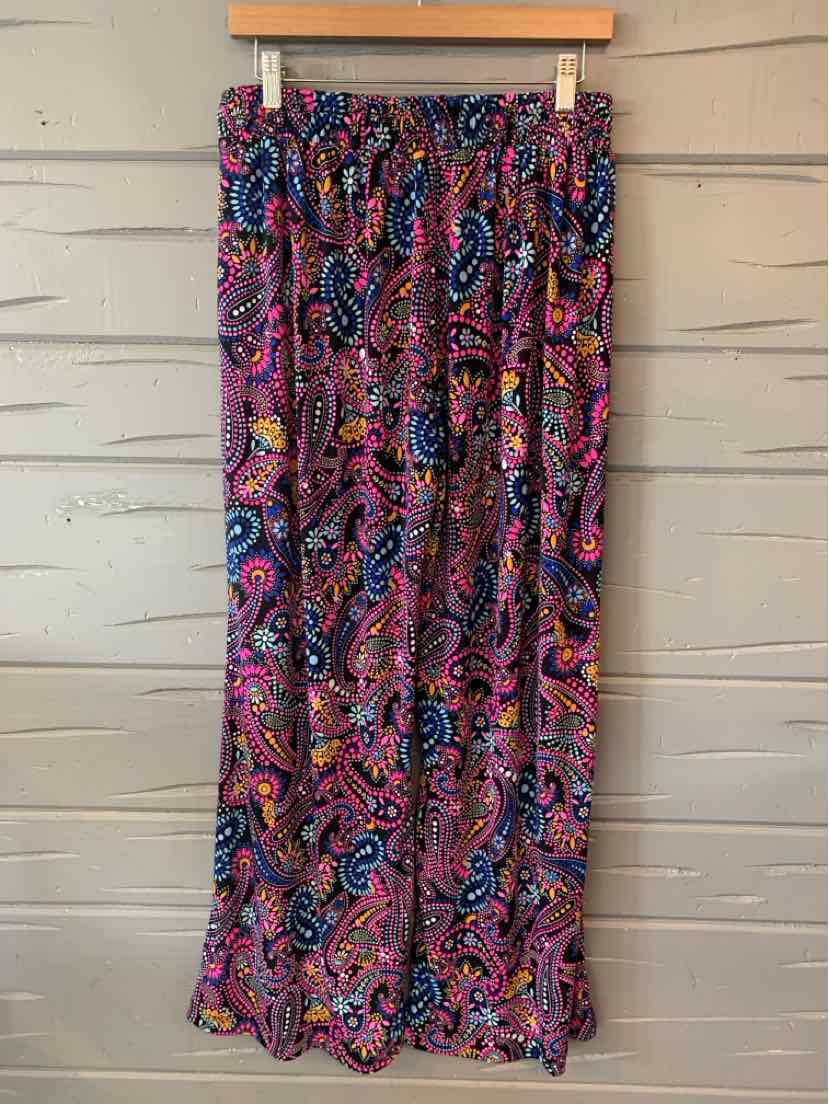 Long flowy skirt with vibrant multicolor paisley pattern and elastic waistband.