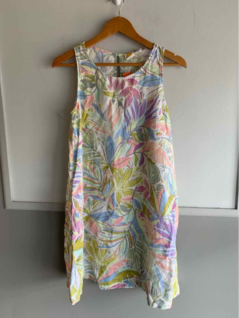 Sleeveless mini dress with pastel floral print in pink, green, yellow, and blue on white background.