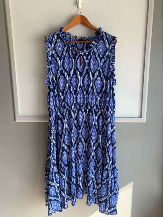 Blue sleeveless dress with abstract diamond pattern and ruffled edges, size 20.