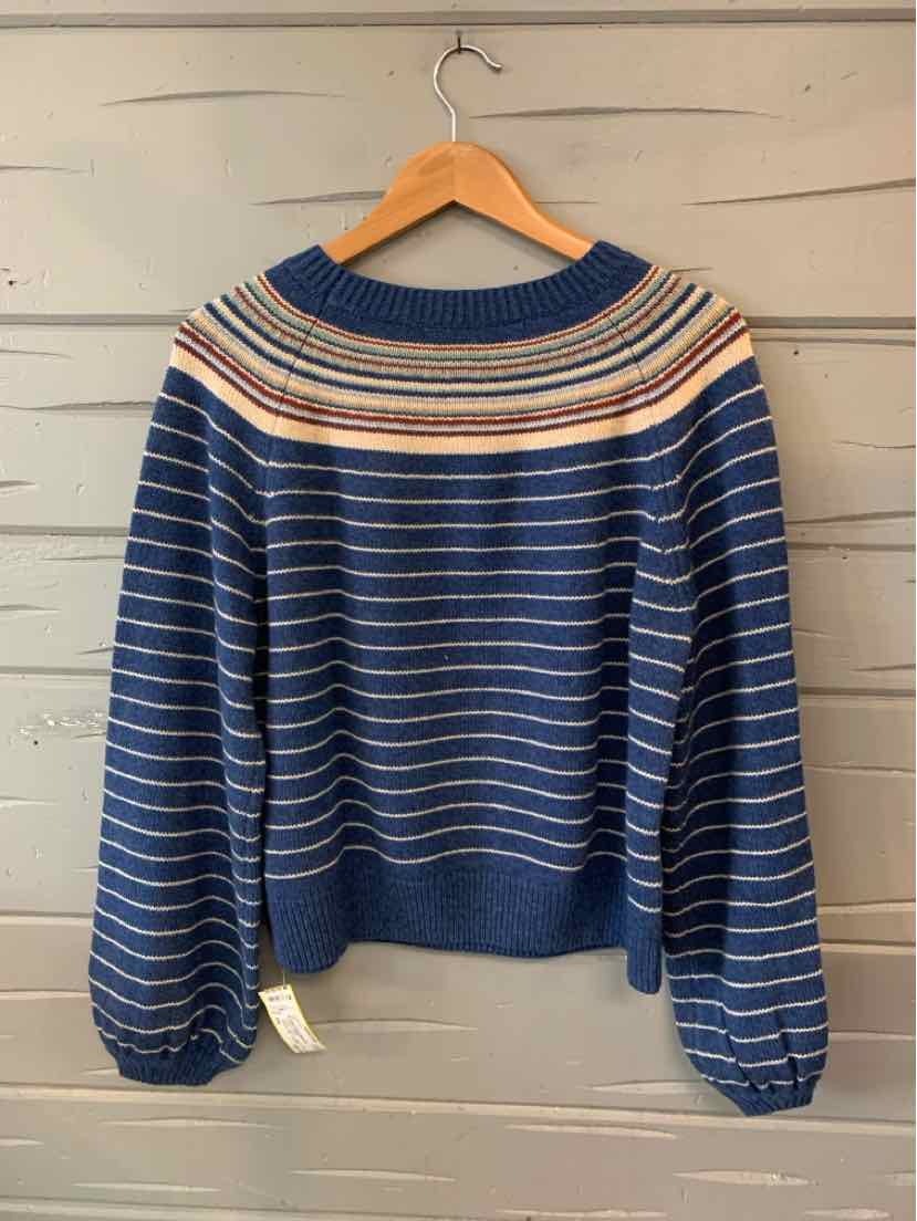Navy blue sweater with cream, orange, and rust stripes across yoke and slim horizontal stripes on sleeves and body.
