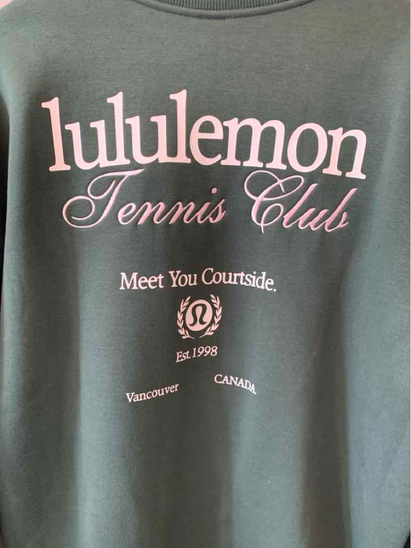 Green Lululemon sweatshirt with pink "lululemon Tennis Club" text and logo on front.