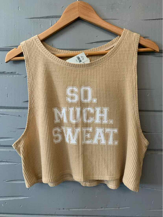 Tan ribbed sleeveless crop tank with white "SO. MUCH. SWEAT." text on front.