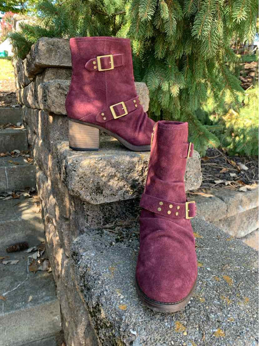 Burgundy suede ankle boots with folded cuffs, buckle straps, and low block heels.