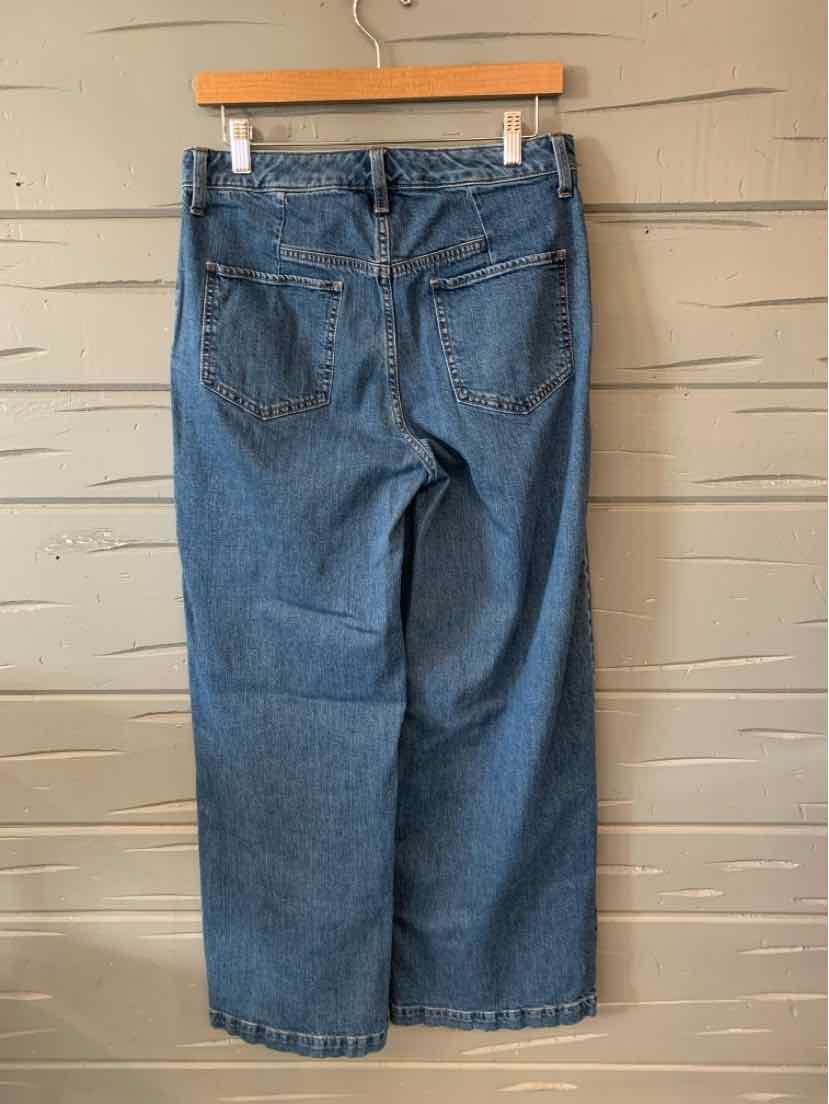 Blue high-waist wide-leg denim jeans with back pockets and visible seam detailing.