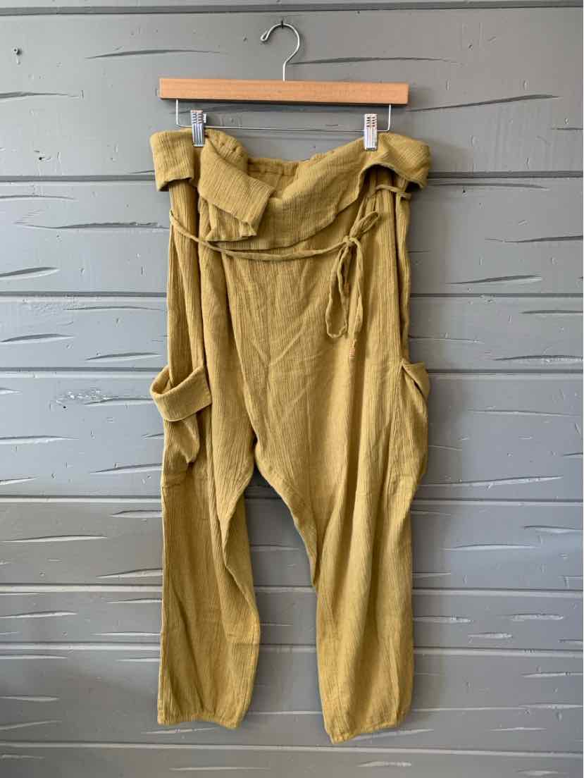Olive green high-waist linen pants with a wrap belt and slouchy pockets.