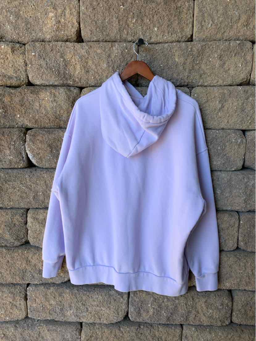 Light lavender Under Armour hoodie with a soft fleece look, front kangaroo pocket, and drawstring hood.