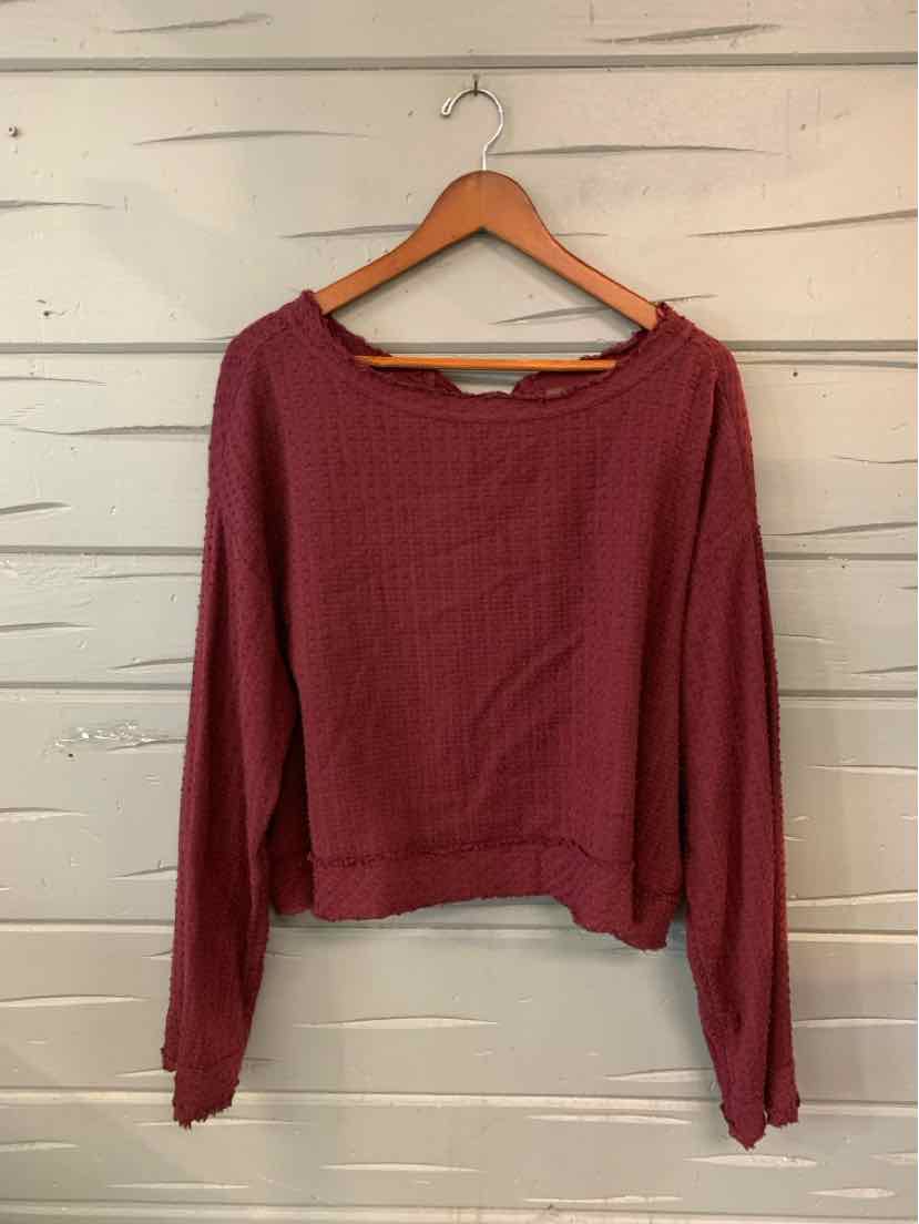 Long-sleeve burgundy knit sweater with crew neck and relaxed fit, size XS.