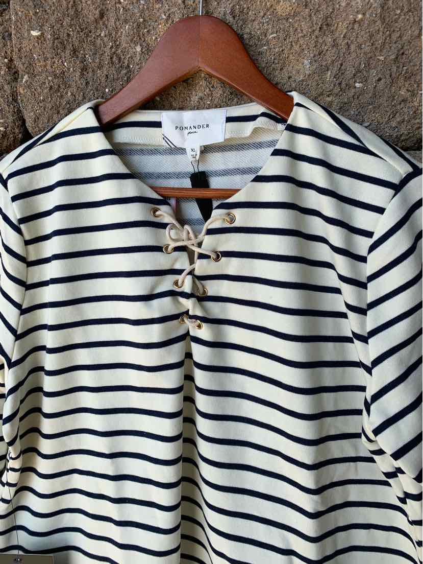 Cream and black striped long sleeve top with lace-up neckline in size XL on wooden hanger.