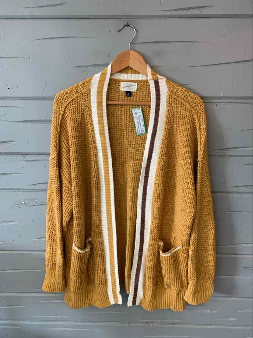 Mustard yellow knit cardigan with white and brown striped trim, open front, and two front pockets.
