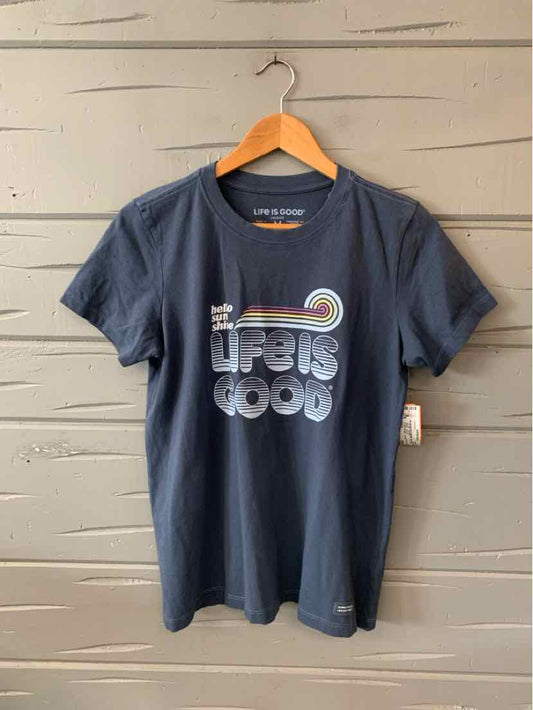 Navy blue short-sleeve cotton t-shirt with "Life is Good" graphic and retro sunset design on chest.