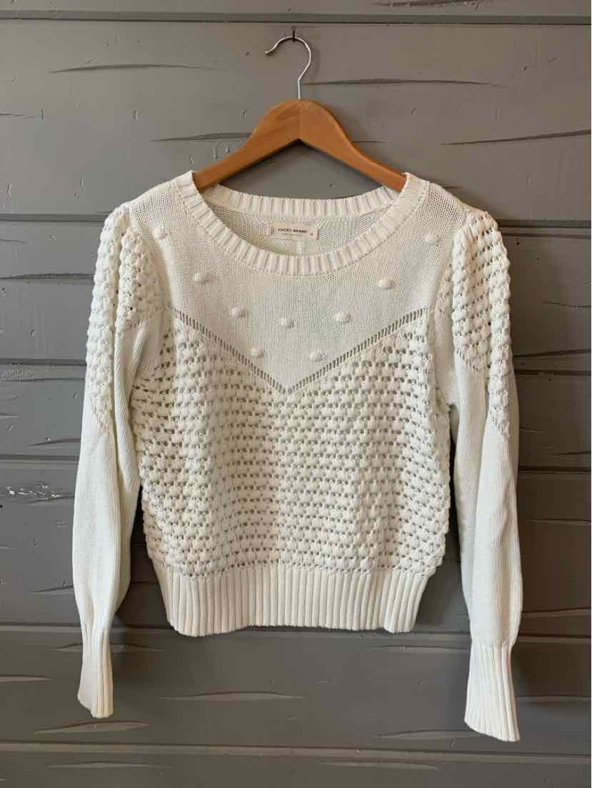 White knit sweater with textured bobble and chevron patterns, ribbed cuffs and hem, medium size.