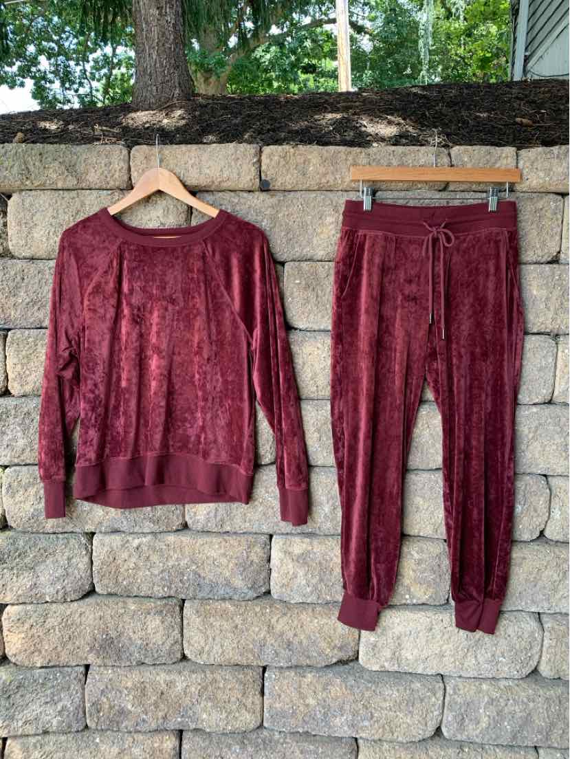 Burgundy velour long-sleeve pullover and matching jogger pants set with ribbed cuffs and waistband.