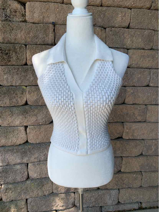 White knit sleeveless top with textured front and collar, slim fit, size small.