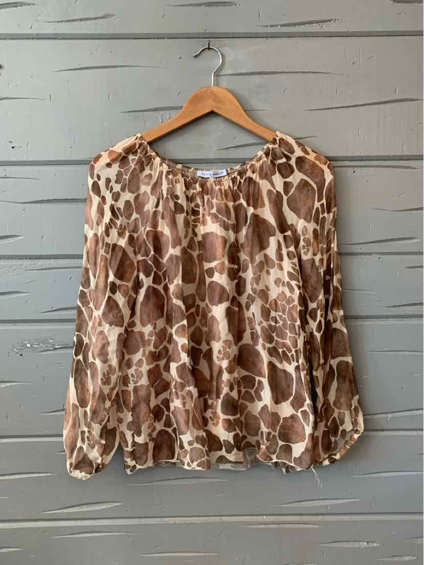 Brown and beige giraffe print sheer blouse with elastic neckline and long puff sleeves.