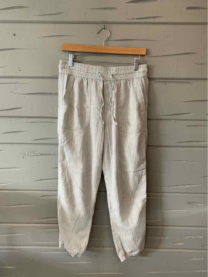 Light gray casual pants with elastic waistband and cuffs, front pockets, and drawstring tie.