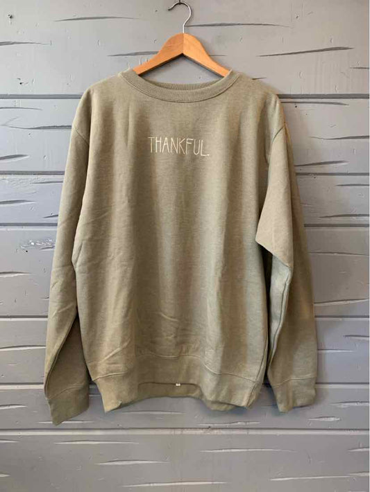 Olive green crewneck sweatshirt with long sleeves and a small “Thankful” chest graphic.