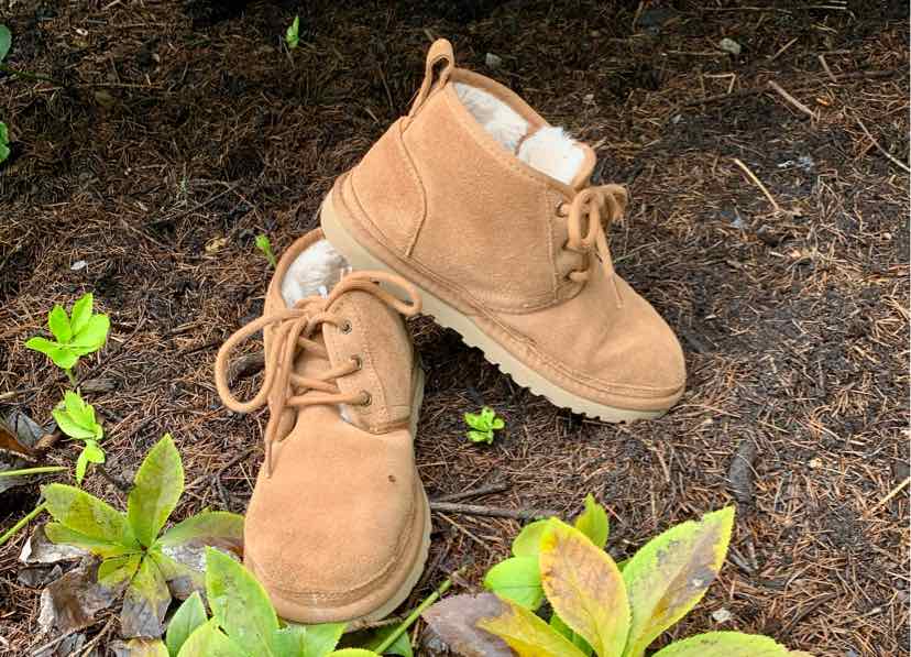 Tan suede ankle boots with lace-up fronts and fluffy white interior lining, size 6.