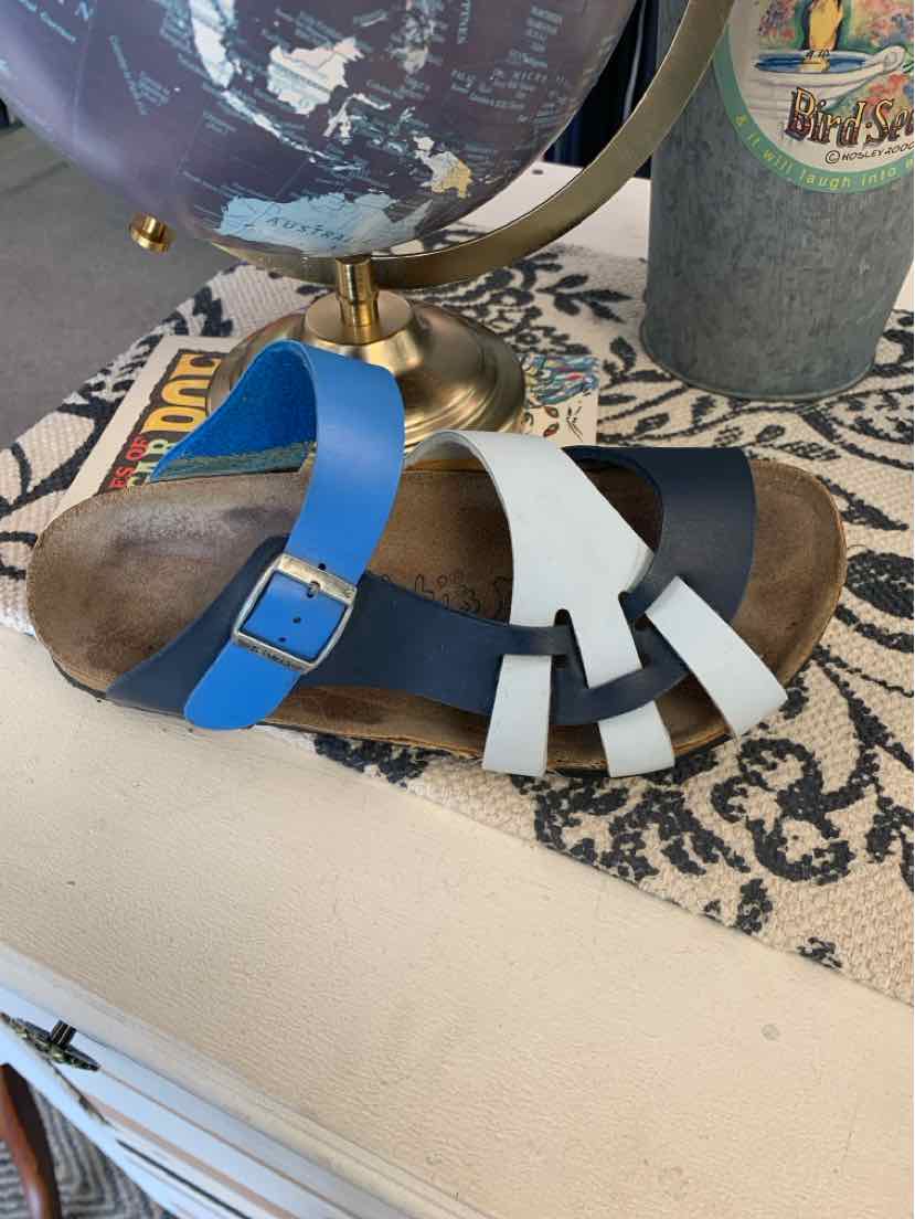 W Birkenstock Multicolor sandal with adjustable blue, white, and black leather straps and cork footbed, size 37.