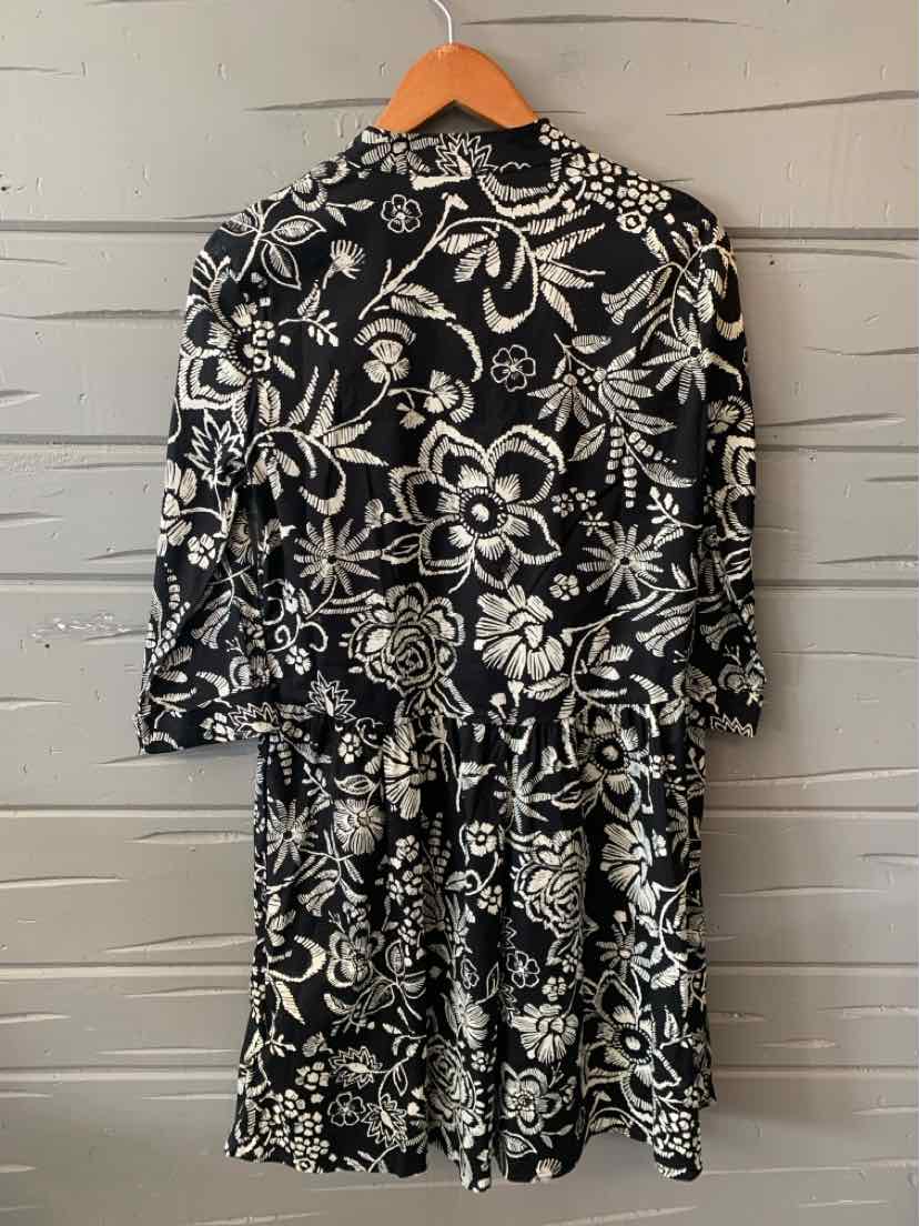 Black floral dress with white detailed flower patterns, long sleeves, and a waist tie, size XS.