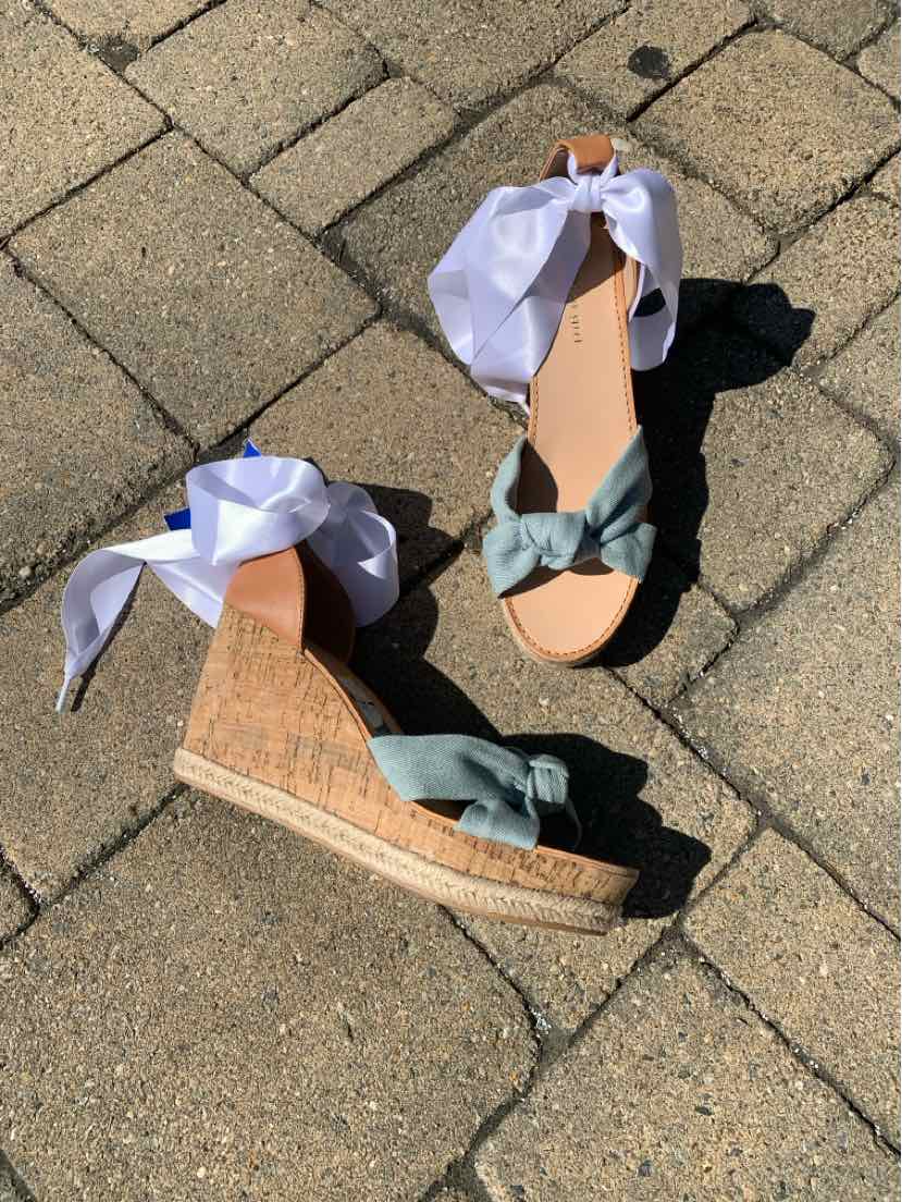 Blue wedge sandals with cork platform and white ankle wrap ties, size 9.5.