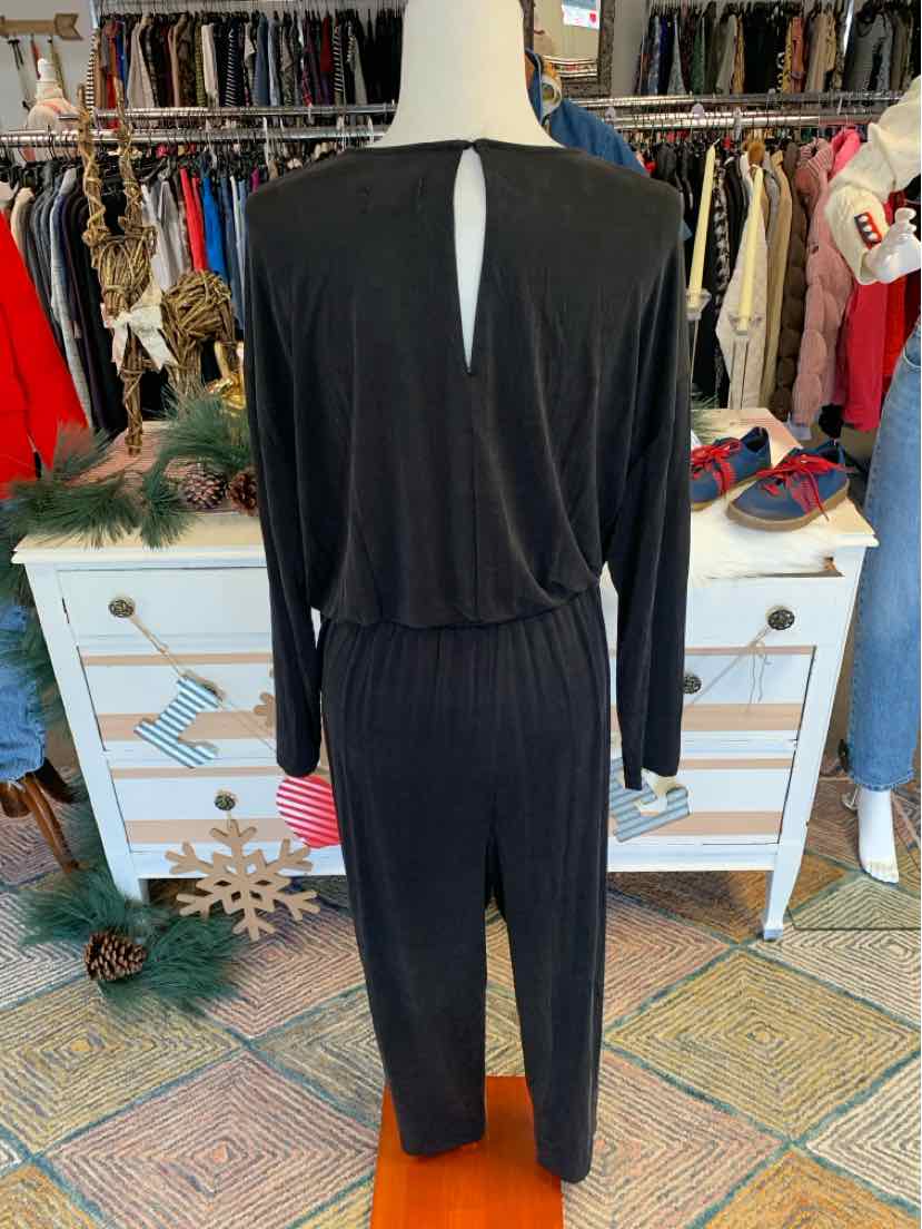 Black long-sleeve jumpsuit with a keyhole back and a cinched waist in large size.