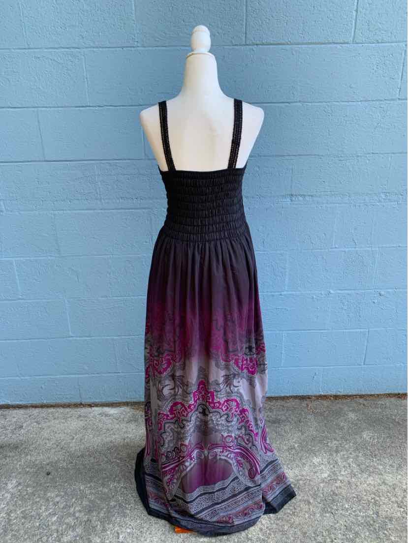 Black and purple maxi dress with paisley pattern, smocked bodice, and wide straps.