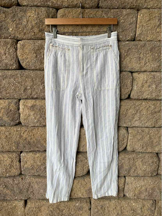 White linen blend pants with thin vertical beige stripes, elastic waistband, and cropped legs.