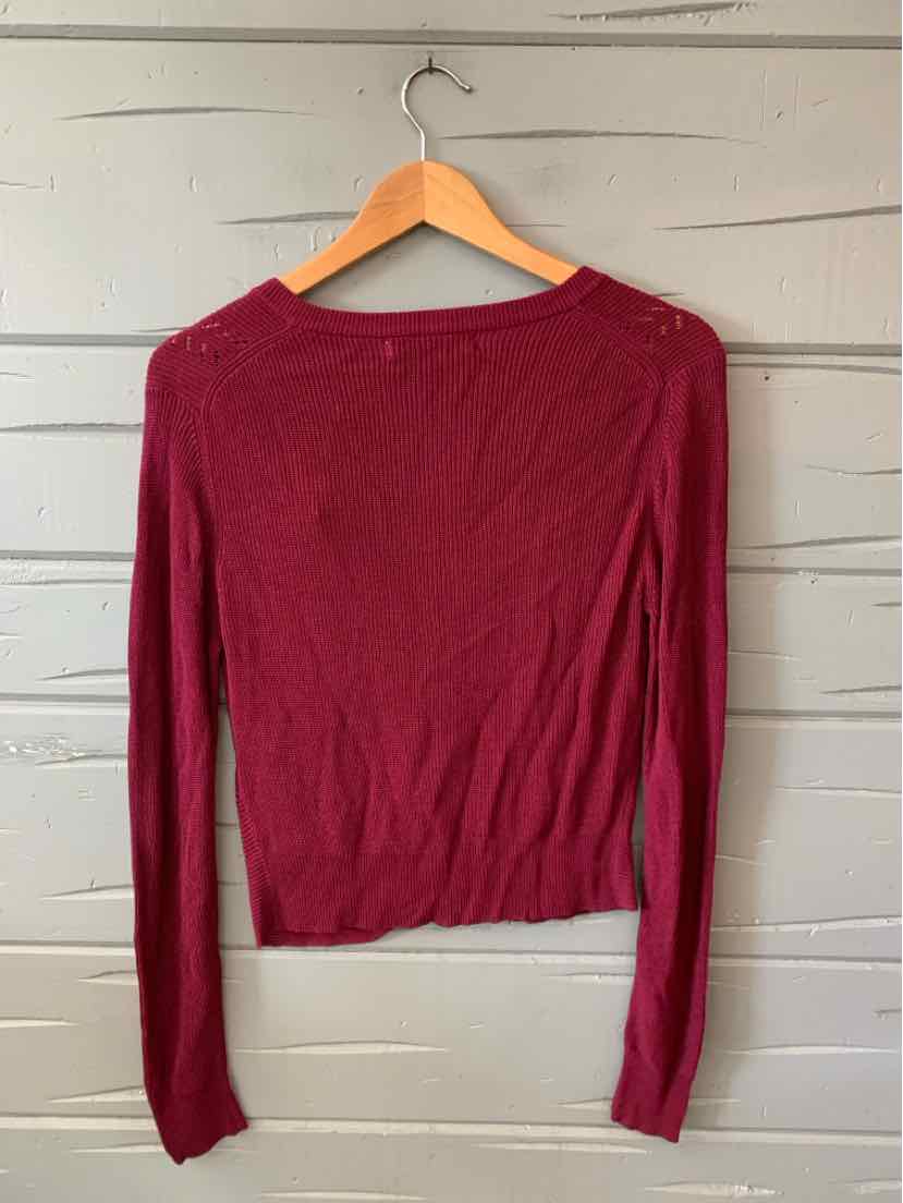 Burgundy long-sleeve fitted knit top with a round neckline and ribbed hem, size small.
