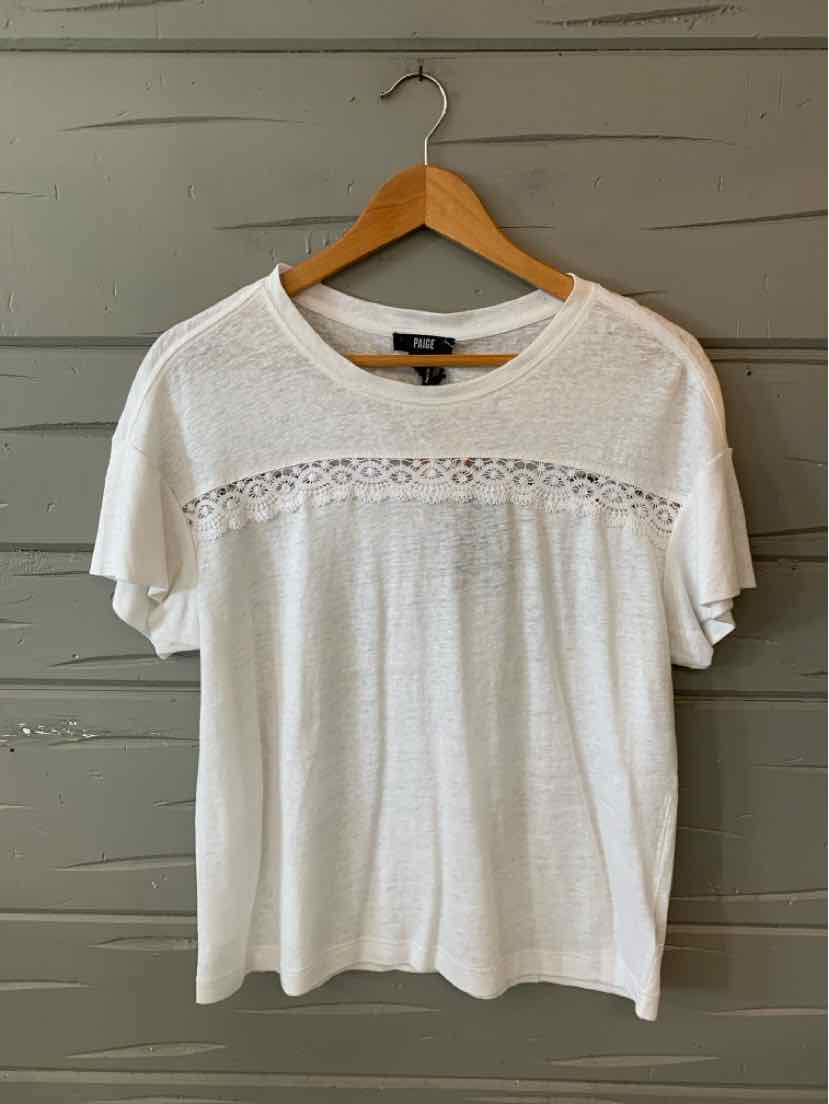 White short-sleeve blouse with lace detail across chest and round neckline on wooden hanger.