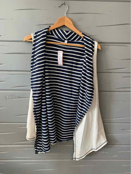 Navy and white striped sleeveless cardigan with draped front and contrasting solid white back panel.