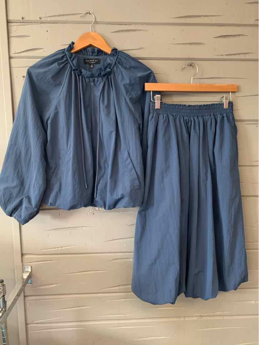 Blue lightweight two-piece set with long-sleeve gathered-neck top and cropped wide-leg pants.
