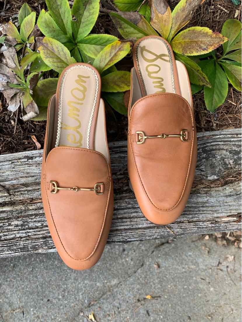 Pair of tan leather Sam Edelman loafers with gold horsebit hardware and rounded toes.