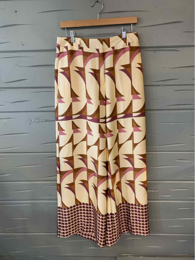 Beige and brown patterned wide-leg pants with geometric designs and a checkered hem, size 6.