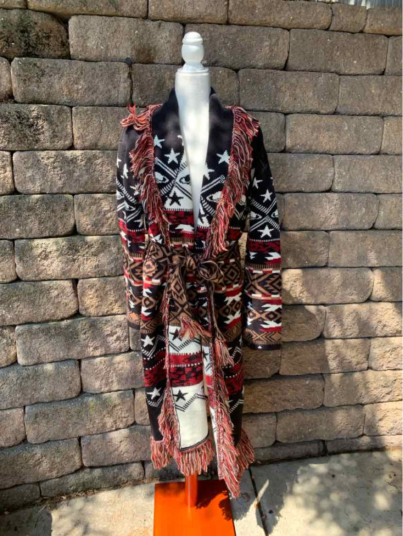 Southwest-patterned black and red knit cardigan with fringed edges and a belted waist, medium size.