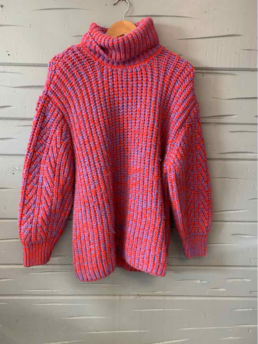 Red and blue knit turtleneck sweater with chunky ribbed sleeves and relaxed fit.