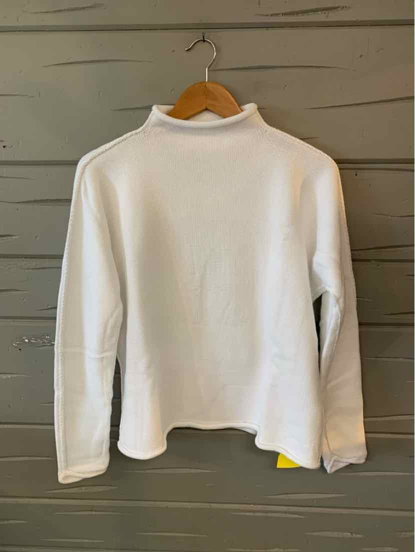 White long-sleeve shirt with high neckline in soft fabric hanging on wooden hanger.