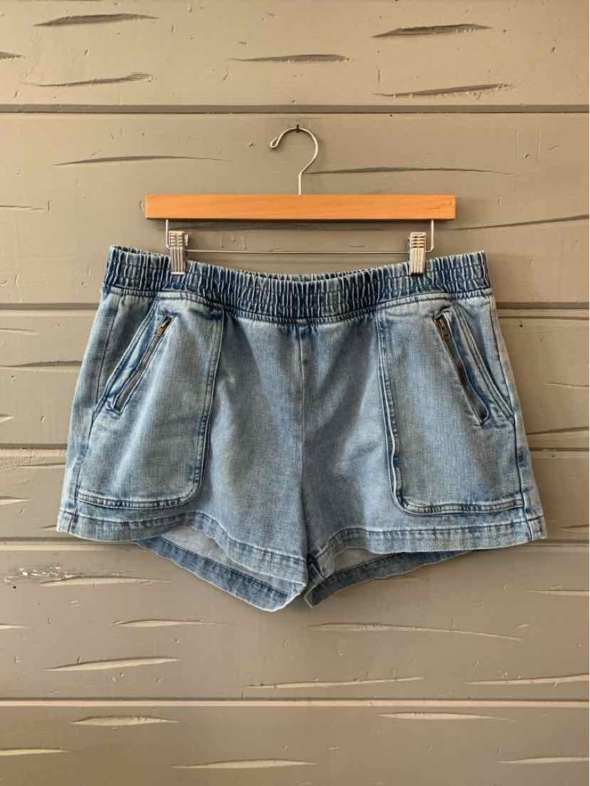 Light blue denim shorts with elastic waistband and front zippered pockets, size XL.