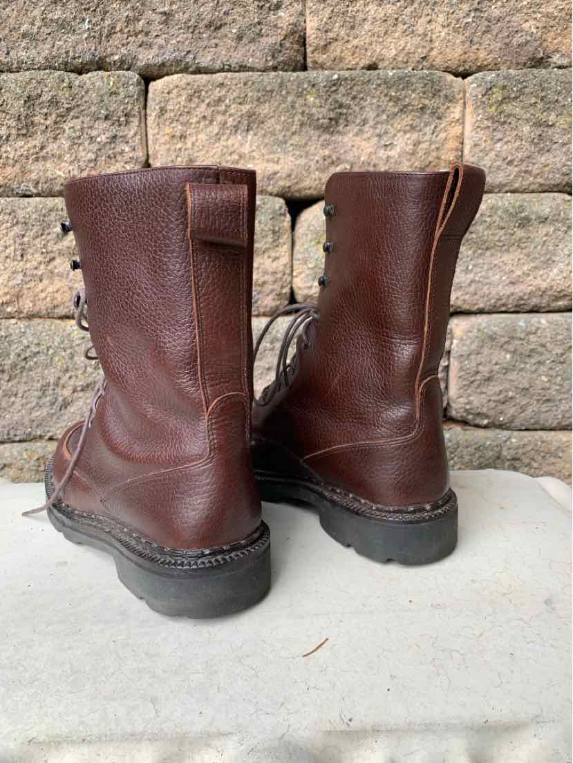 Pair of dark brown leather ankle boots with round toes, lace-up fronts, and sturdy black rubber soles.