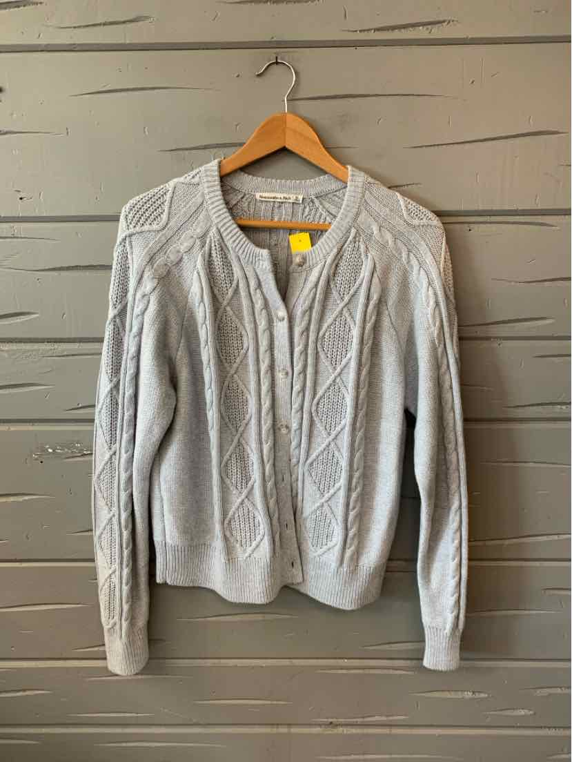 Light gray cable-knit cardigan with round neckline and button front in size XL.