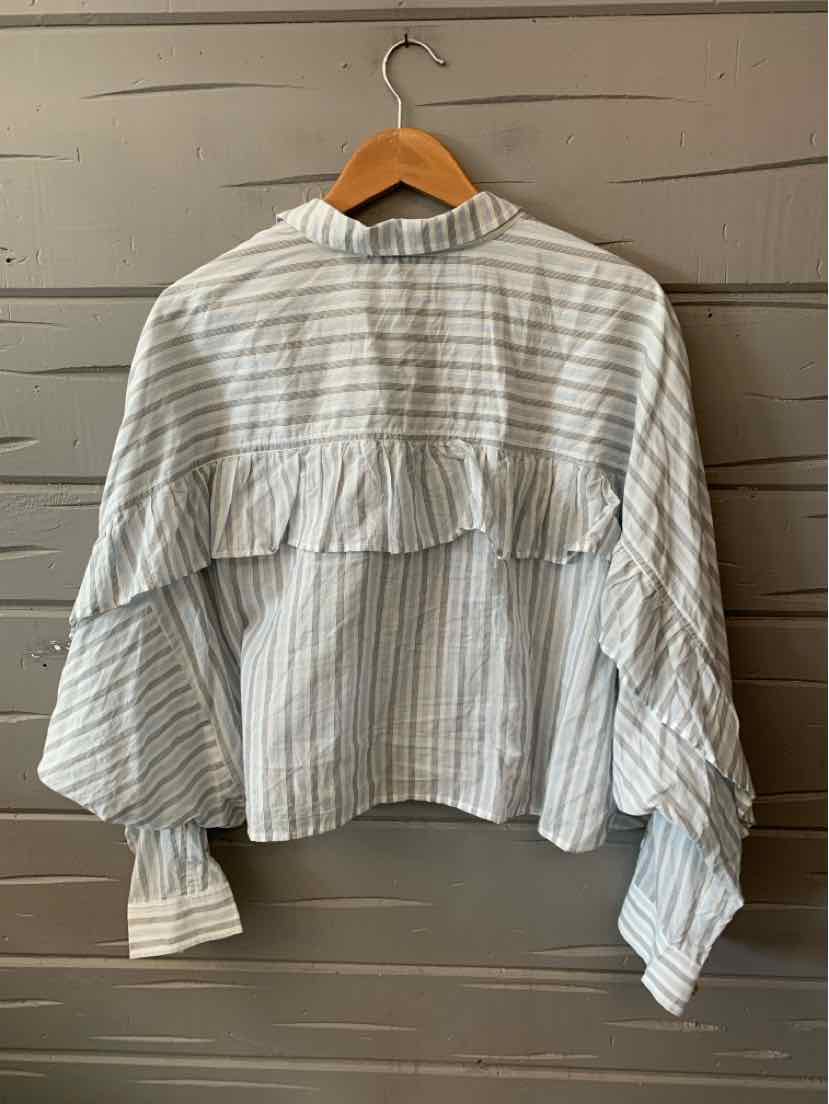 White blouse with thin blue vertical stripes, ruffled yoke, and long puffed sleeves.