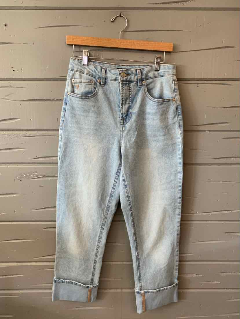 Light wash denim jeans with a relaxed fit, cuffed hems, front and back pockets, and a button fly closure.