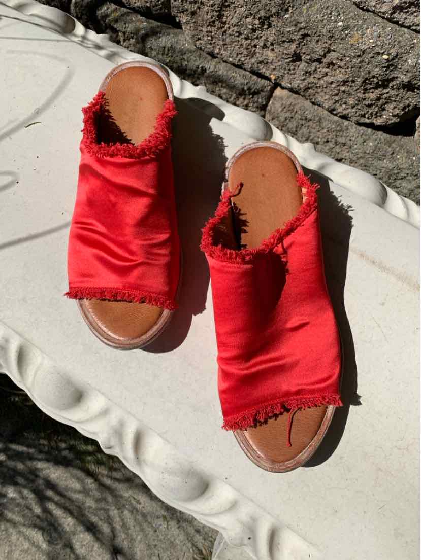 Red satin slip-on sandals with frayed edges and brown cushioned footbeds, size 9.