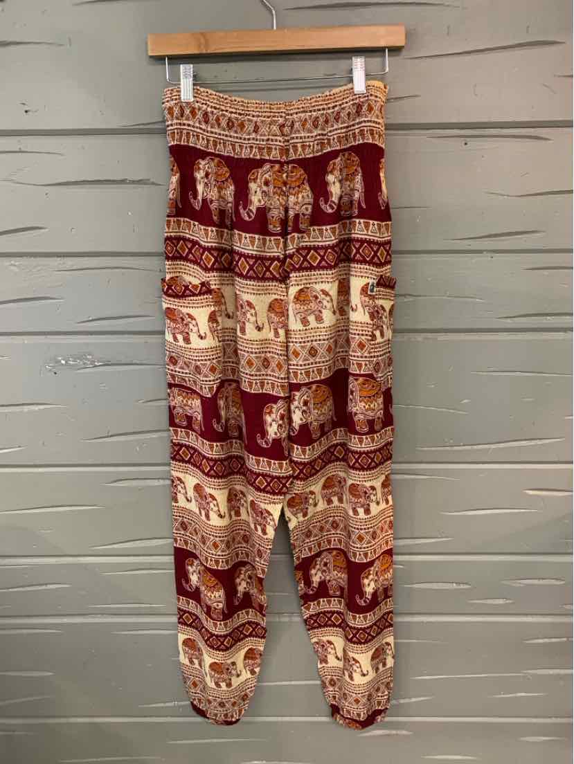 Red elephant print harem pants with elastic waistband and ankle cuffs.